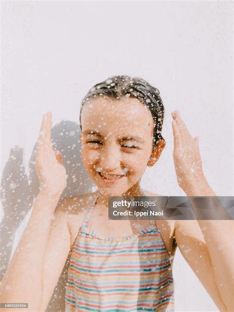 school girl enjoying my outdoor shower|Woman enjoying outdoor shower Stock Photos and Images.